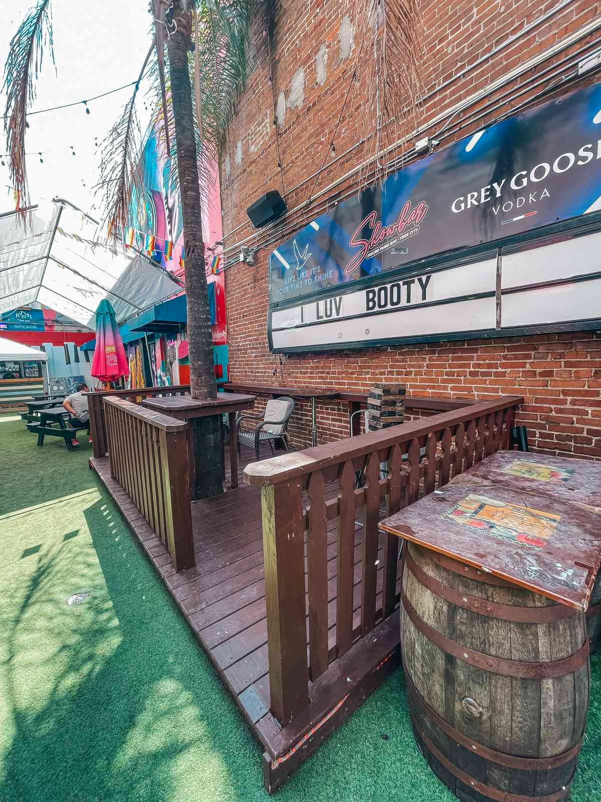 outdoor area of Showbar with sign that reads 