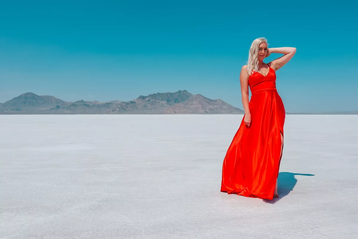 Woman in a red dress at Bonneville Salt Flats in Utah