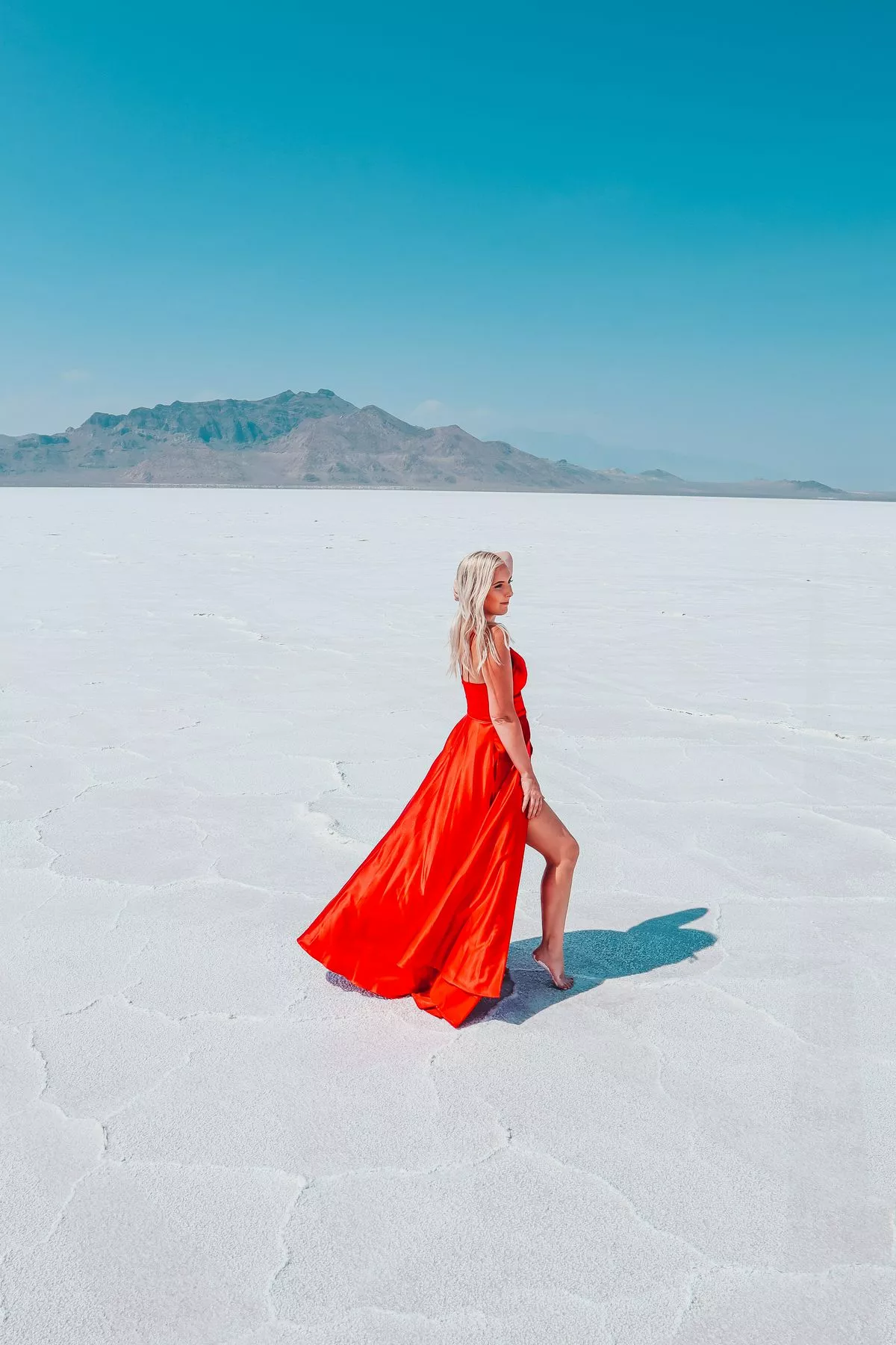 Woman in a red dress at Bonneville Salt Flats