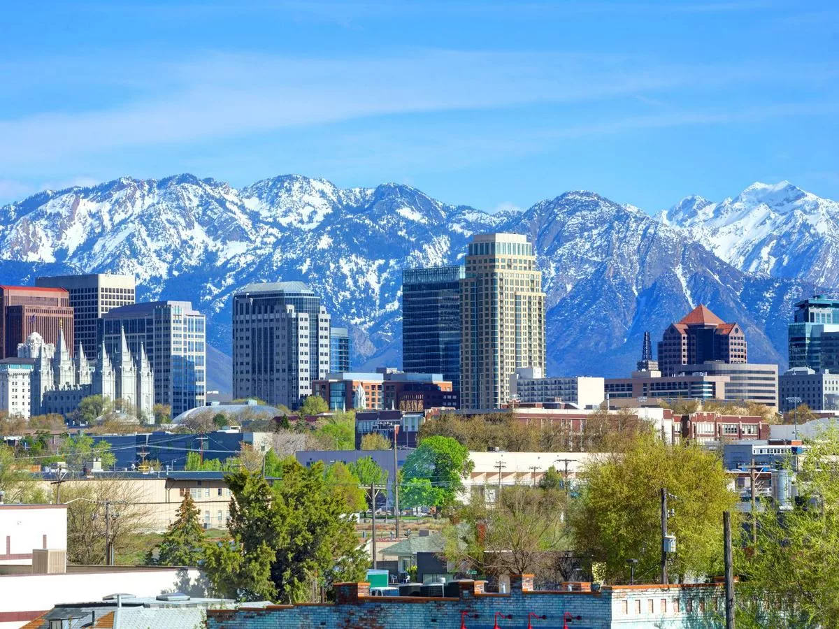Salt Lake City Utah city skyline with snowy mountains in the back