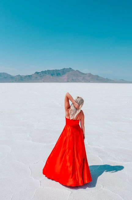 Woman in a red dress at Bonneville Salt Flats in Utah