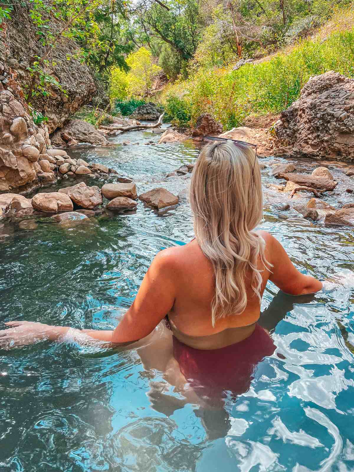Woman enjoying Fifth Water Hot Springs in Utah