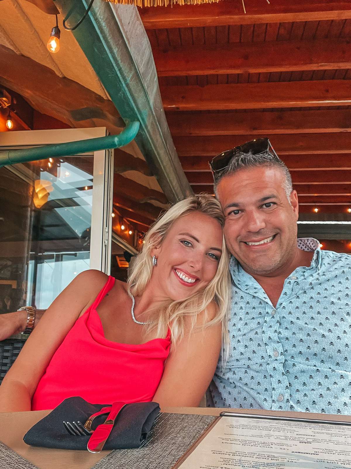 Couple smiling at dinner at Oasis on the Beach