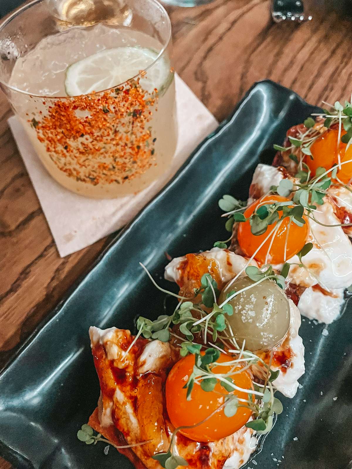 Milk bread and a cocktail from Noble Rice in Tampa for date night restaurants