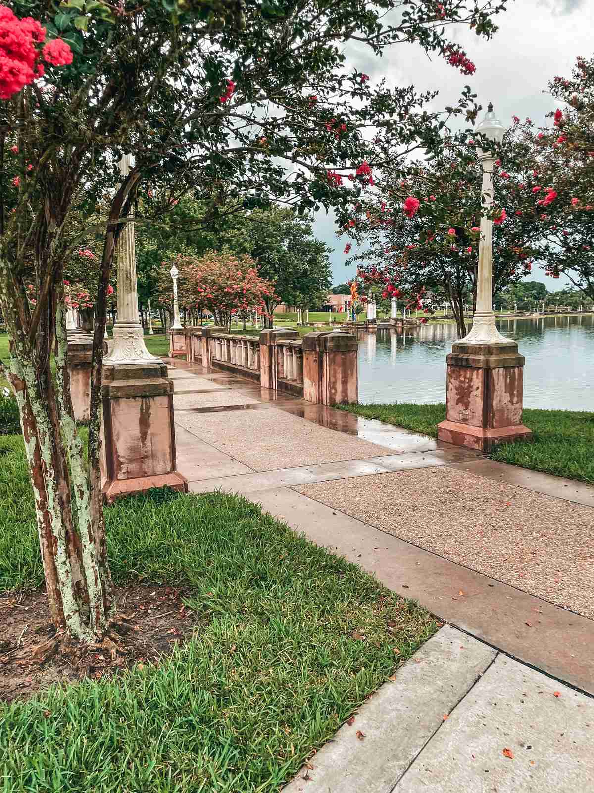 Bridge surrounded by fresh blooms at Mirror Park in Lakeland