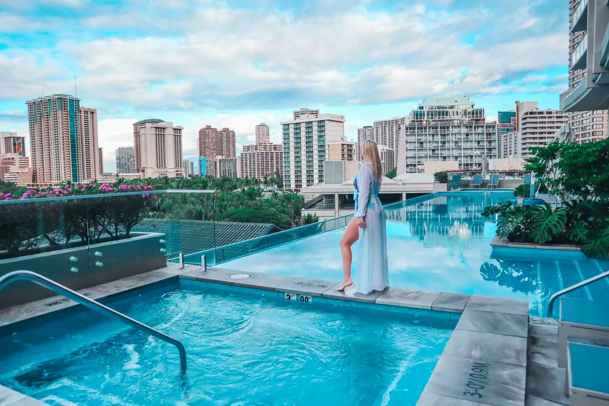 Enjoying the infinity pool at one of the best places to stay in Waikiki, the Ritz Carlton Waikiki