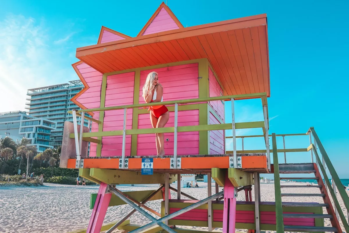woman in the Life guard stand on South Beach Miami