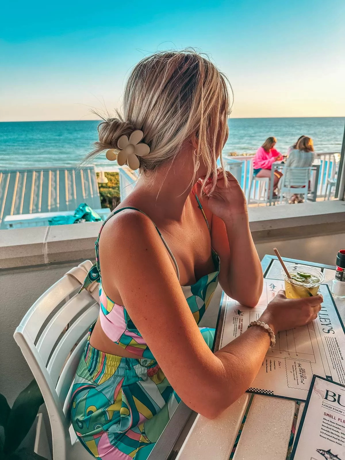 woman holding a drink 