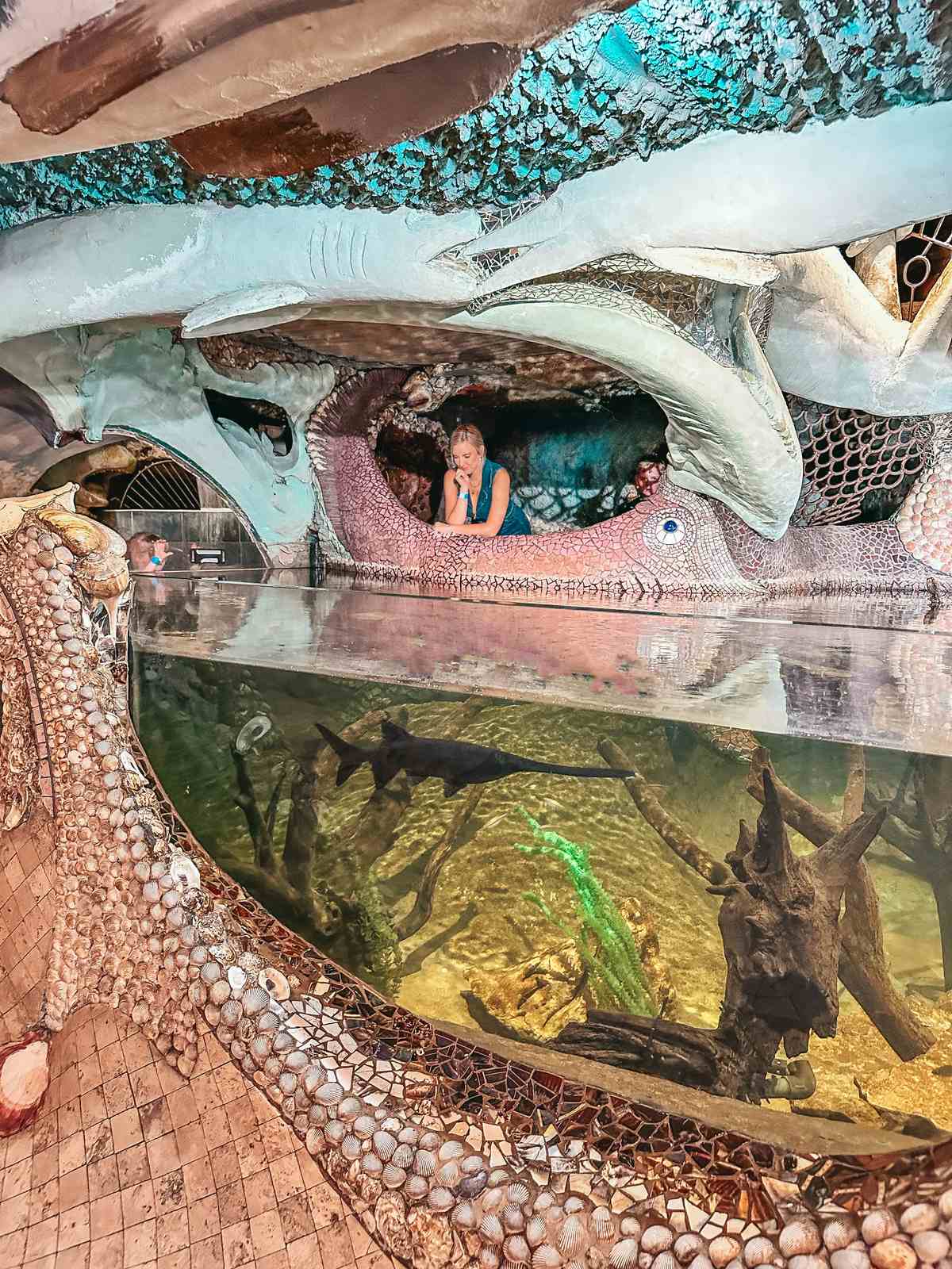 woman looking at the aquarium in City Museum while spending the Weekend in St. Louis 