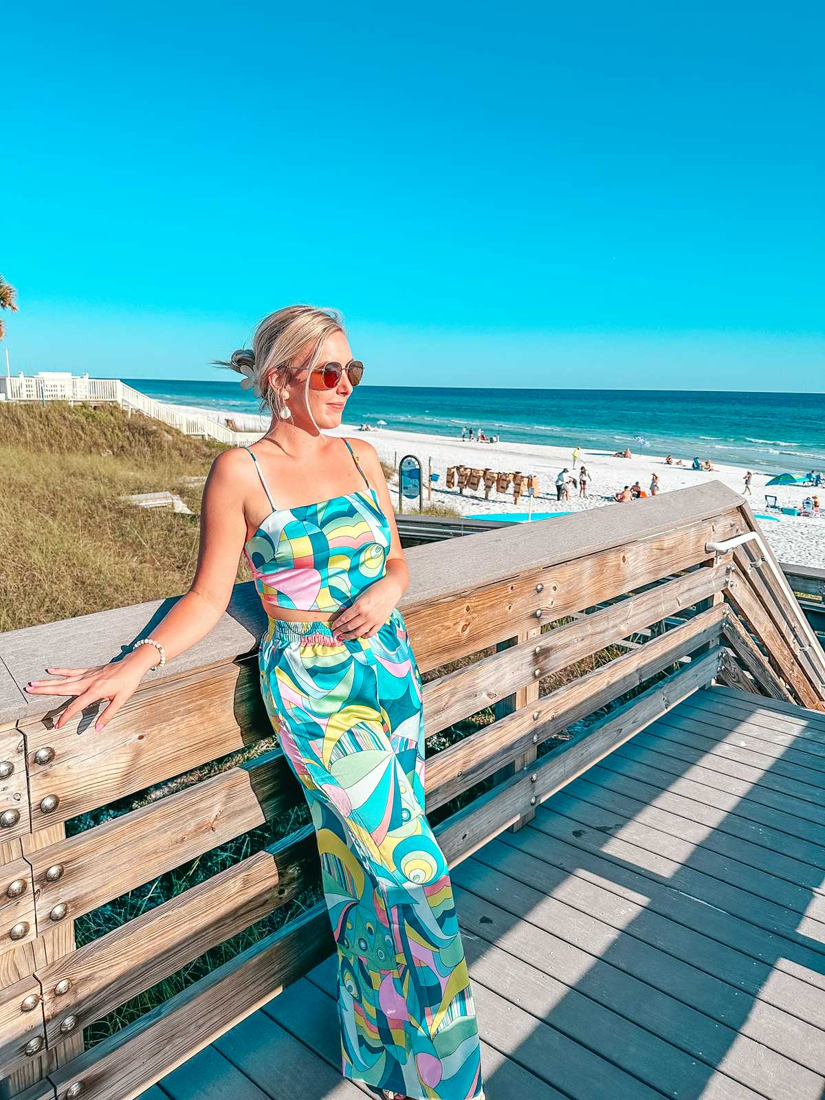 woman at the board walk in Santa Rosa Beach one of the things to do in 30A