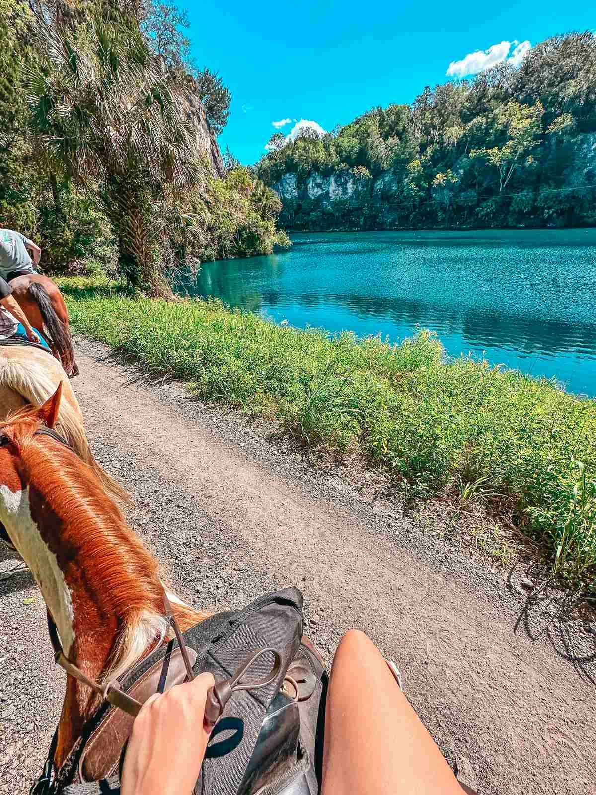 woman riding a horse in the park for a weekend getaways from Tampa