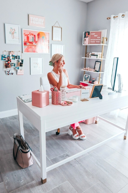 Travel blogger and content creator home office setup. Feminine home office look with pink, white, and gold color scheme