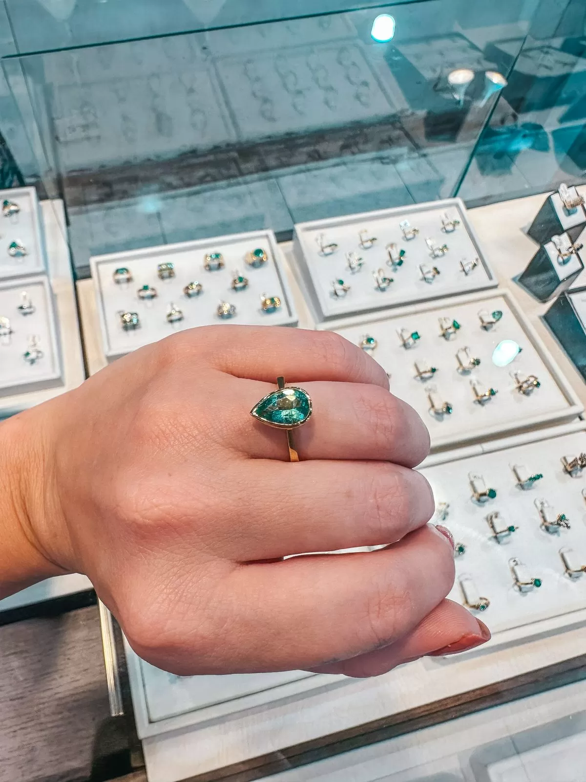 Trying on emerald rings in Colombia