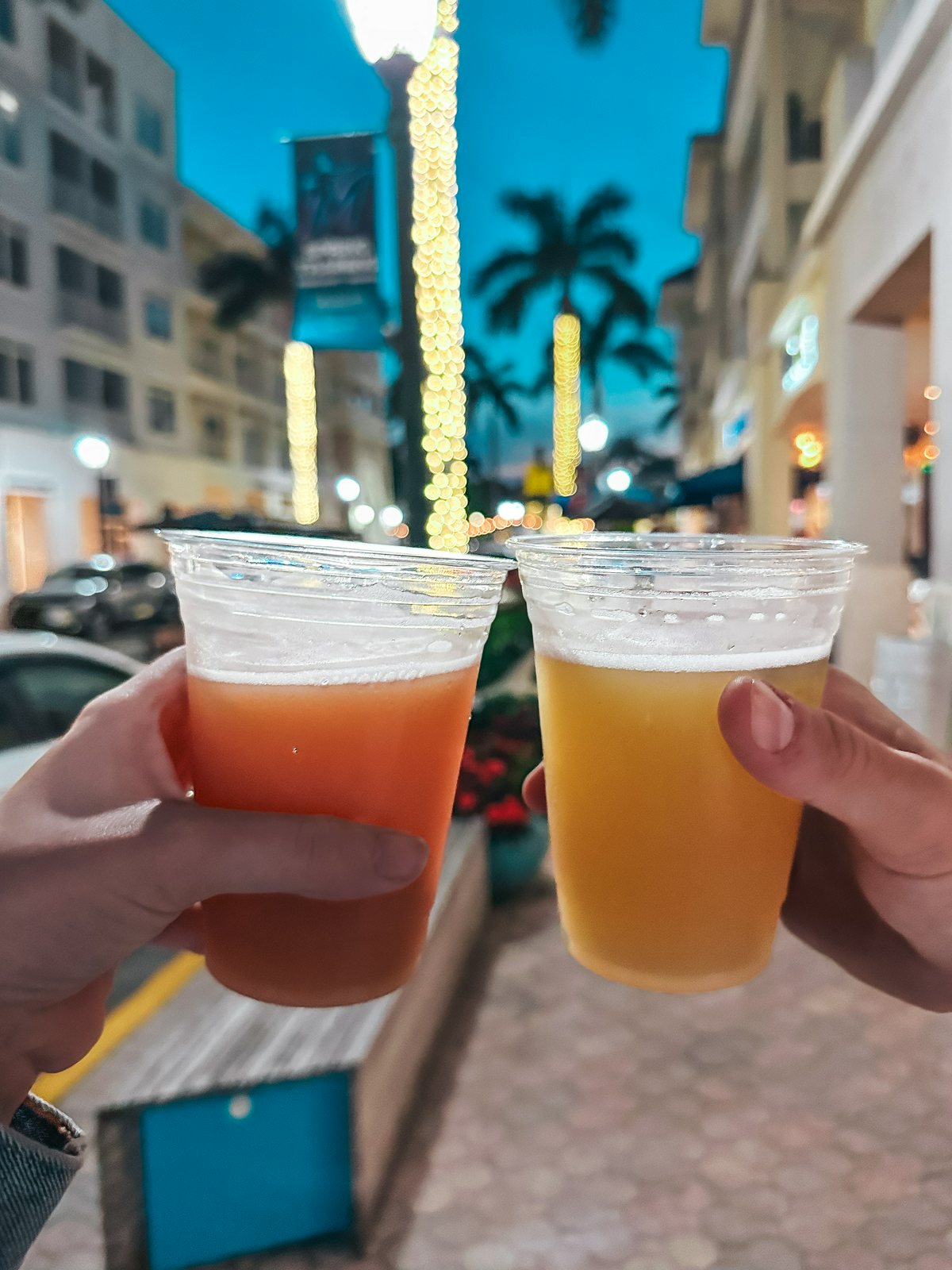 Cheersing beers while walking around Abacoa