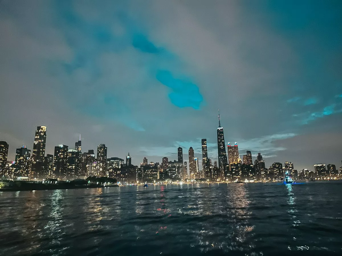 View of Chicago city skyline at night from Lake Michigan
