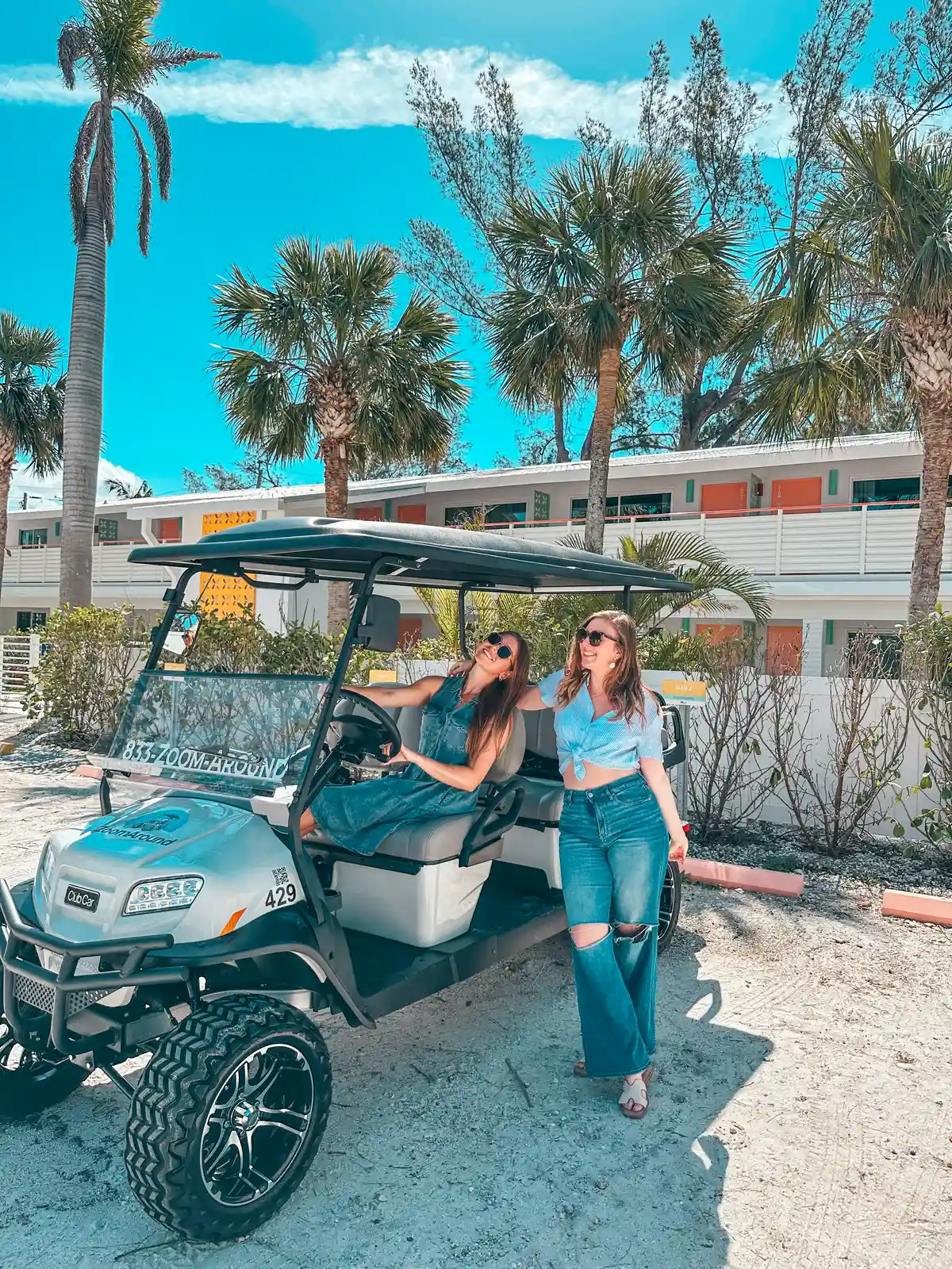 Friends enjoying golf cart rental on Anna Maria Island