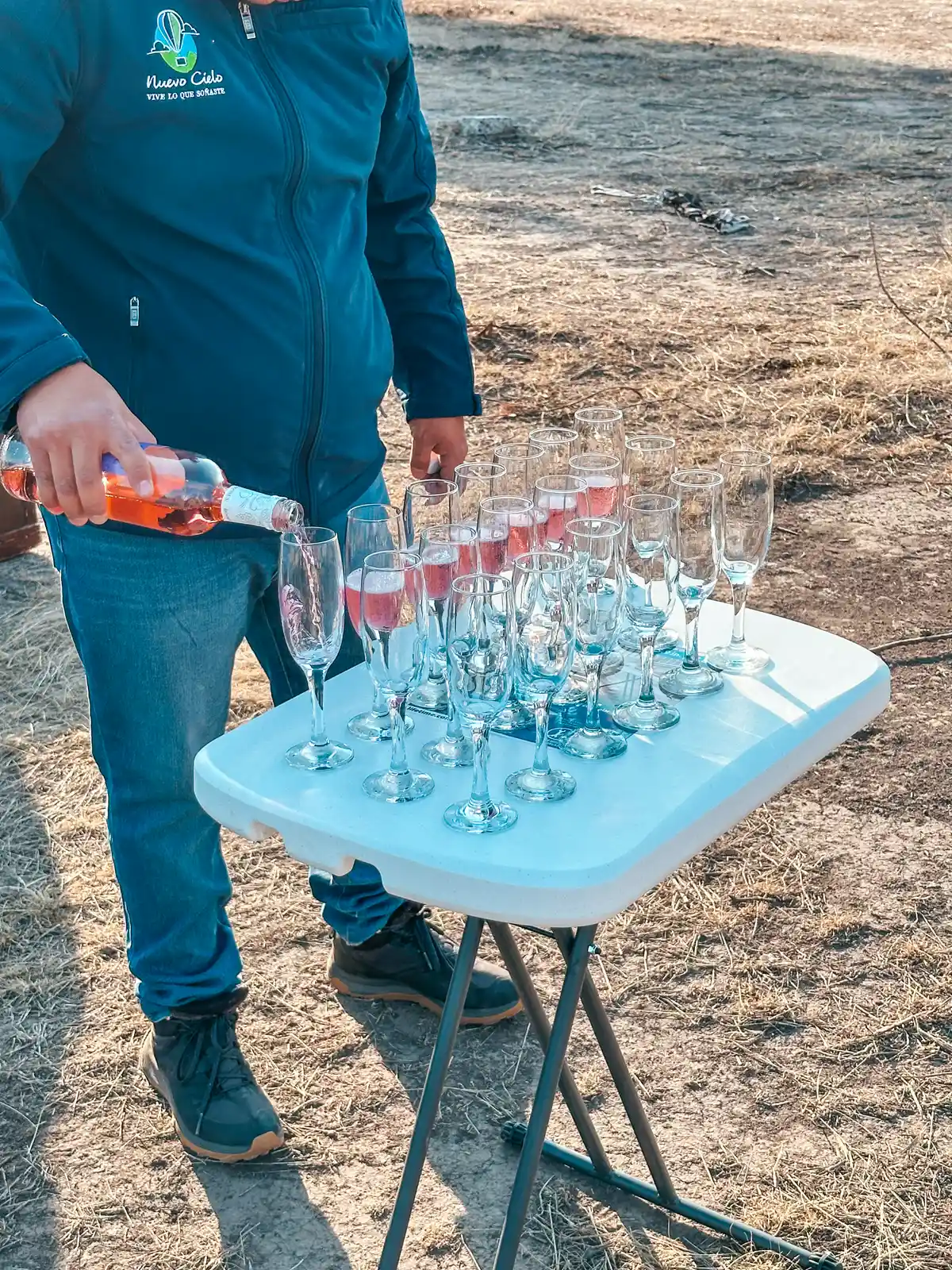 Pouring champagne for toast after hot air balloon ride Mexico City
