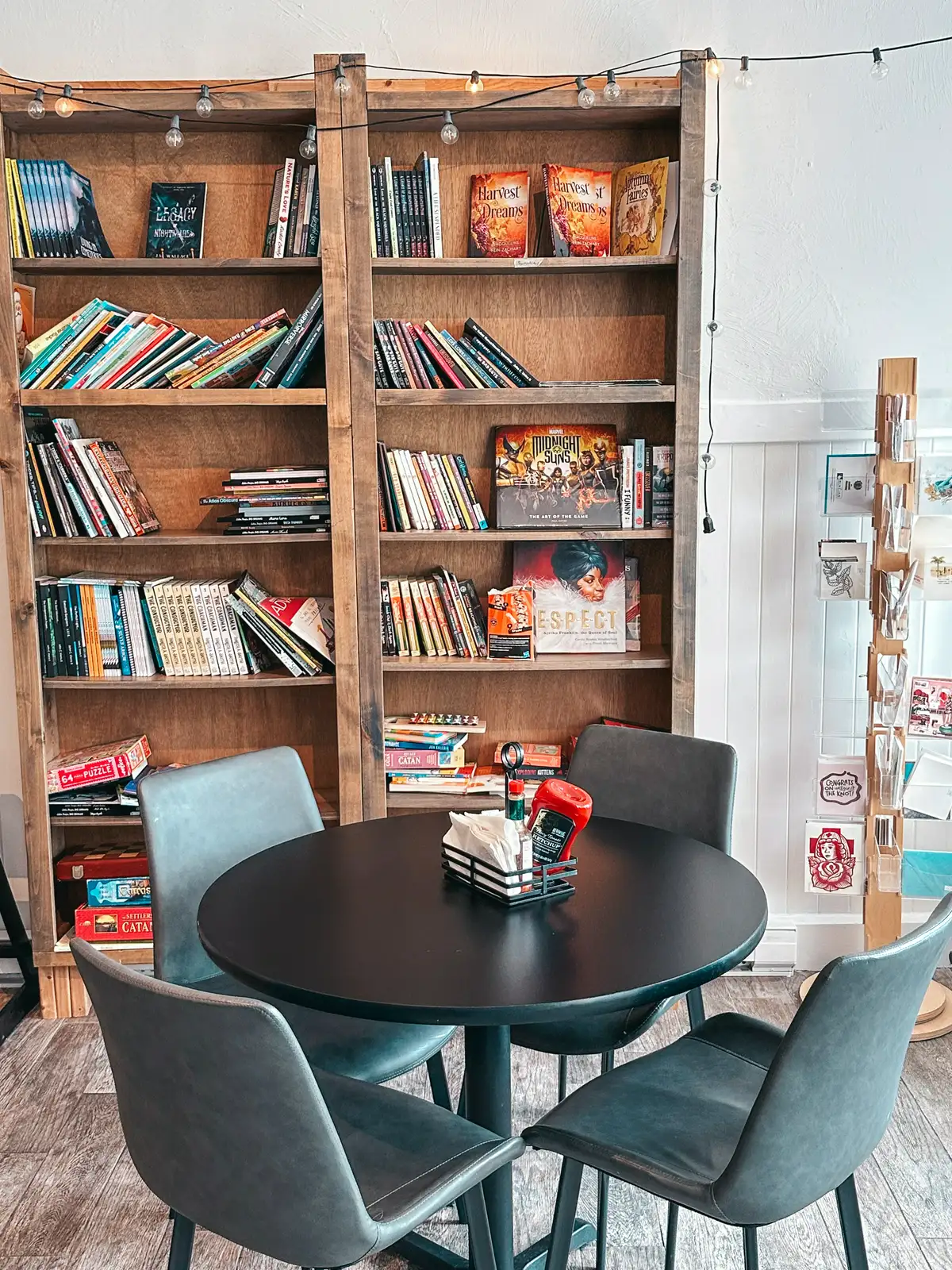 Books and seating area at Bread and Roses Coffee Shop in Hyannis