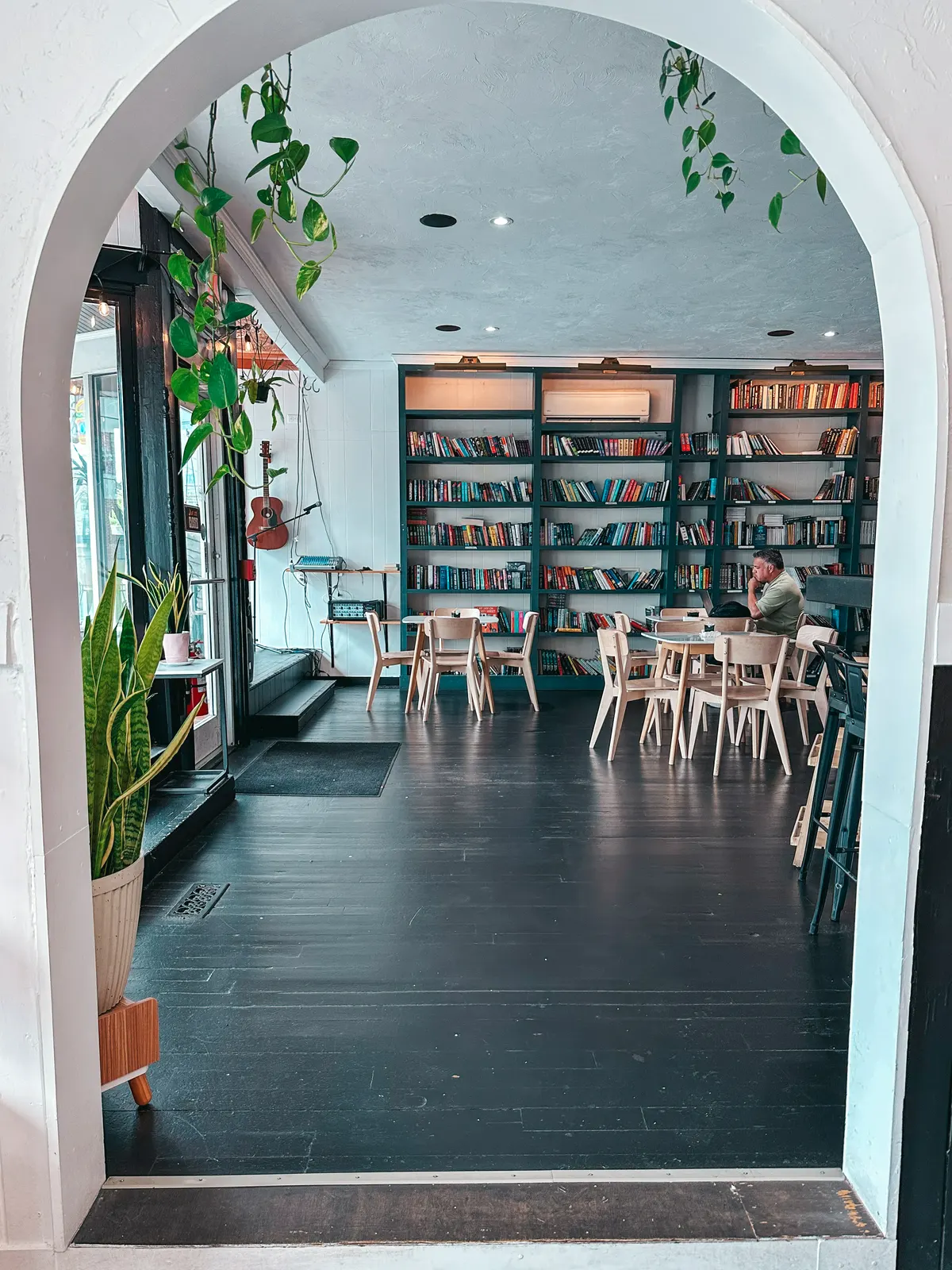 Books plants and seating at Bread and Roses Coffee Shop on Cape Cod