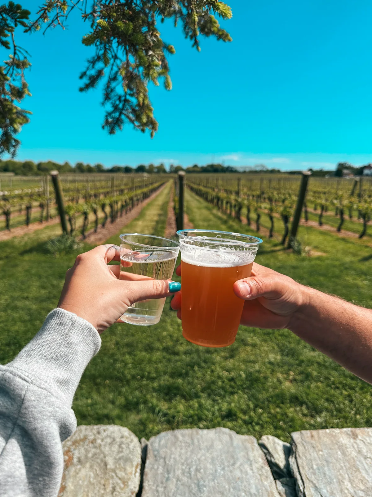 Cheersing at Newport Vineyards in Newport Rhode Island