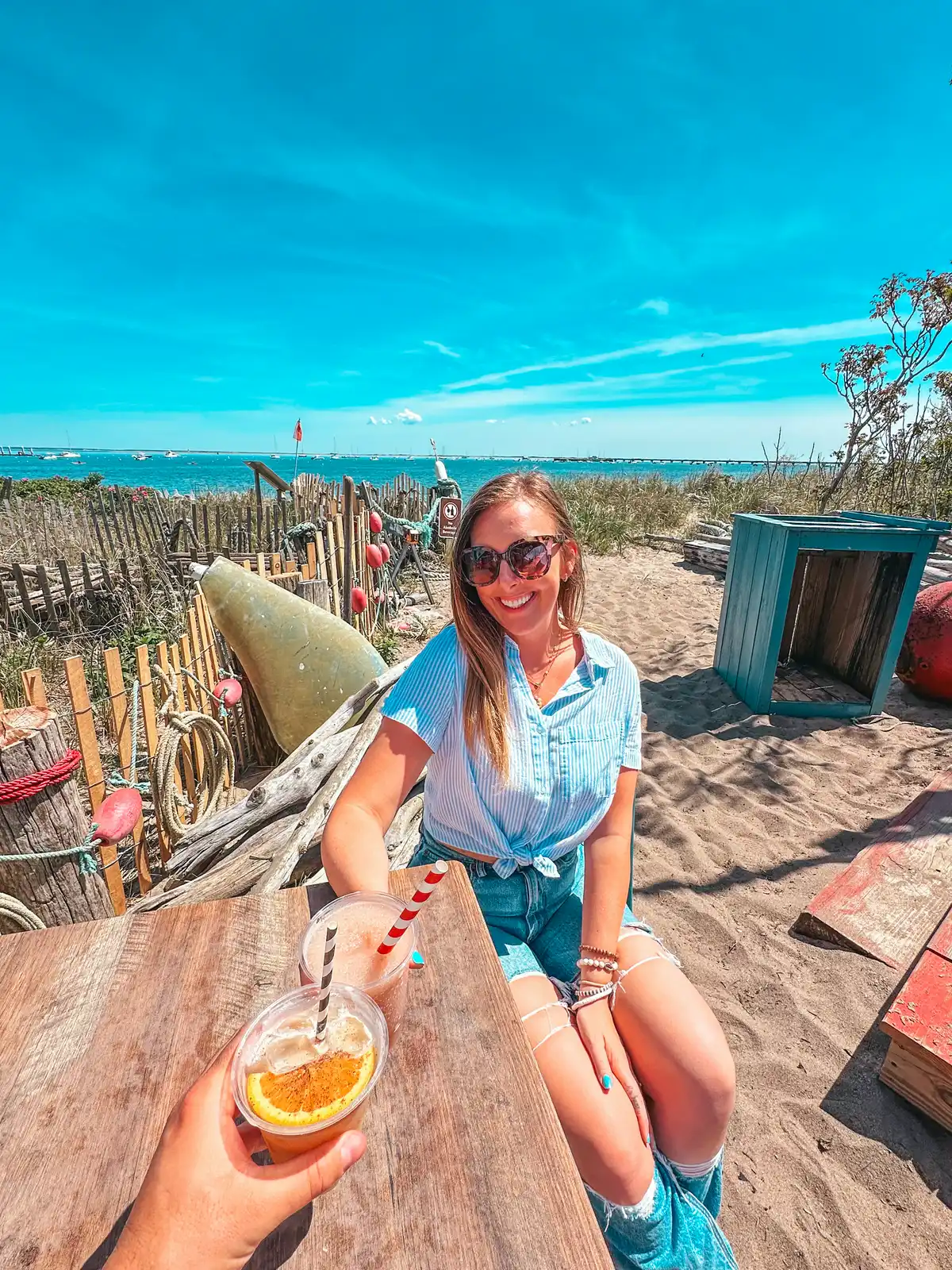 Cheersing on beach seating at The Canteen in Provincetown
