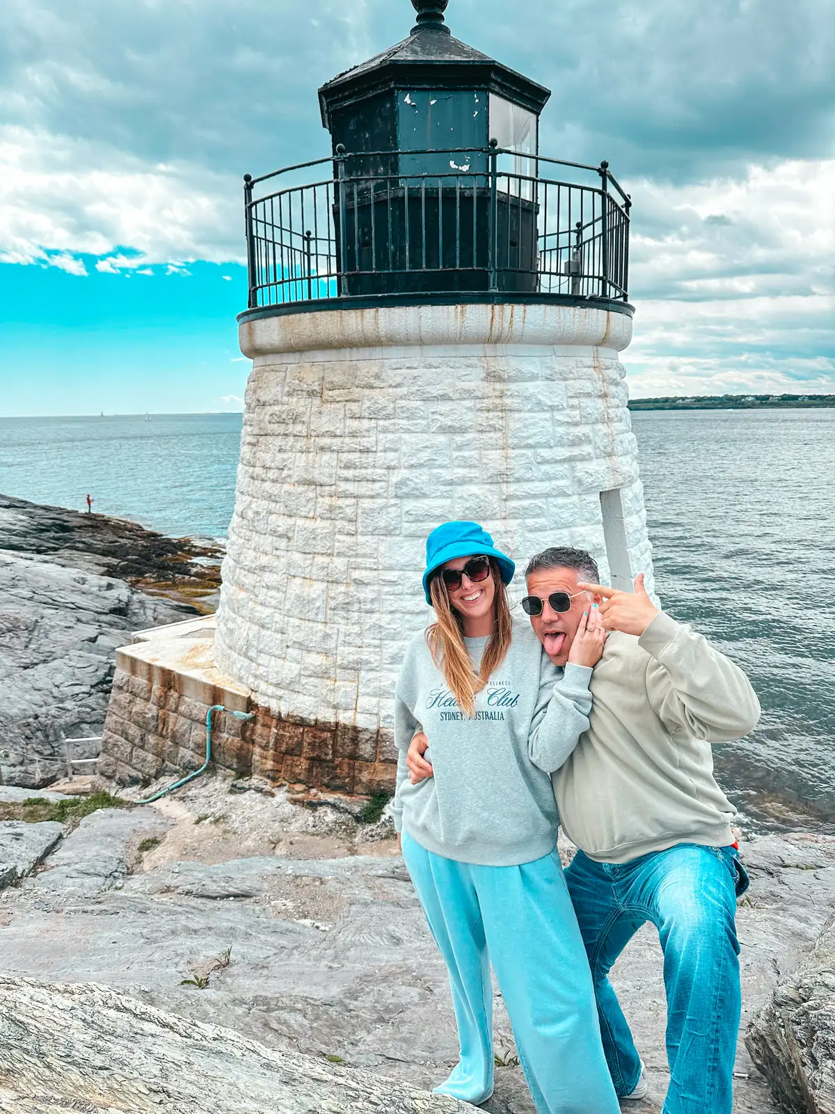 Couple posing at Castle Hill Lighthouse in Newport Rhode Island