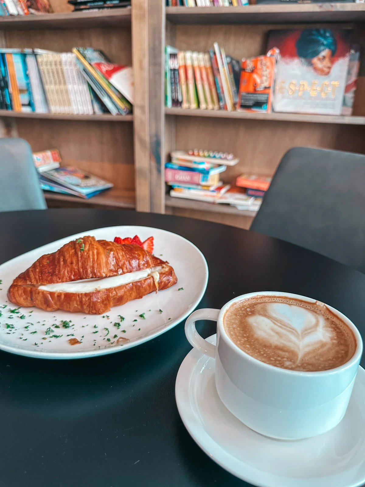 Croissant and hot latte from Bread and Roses Coffee Shop in Hyannis