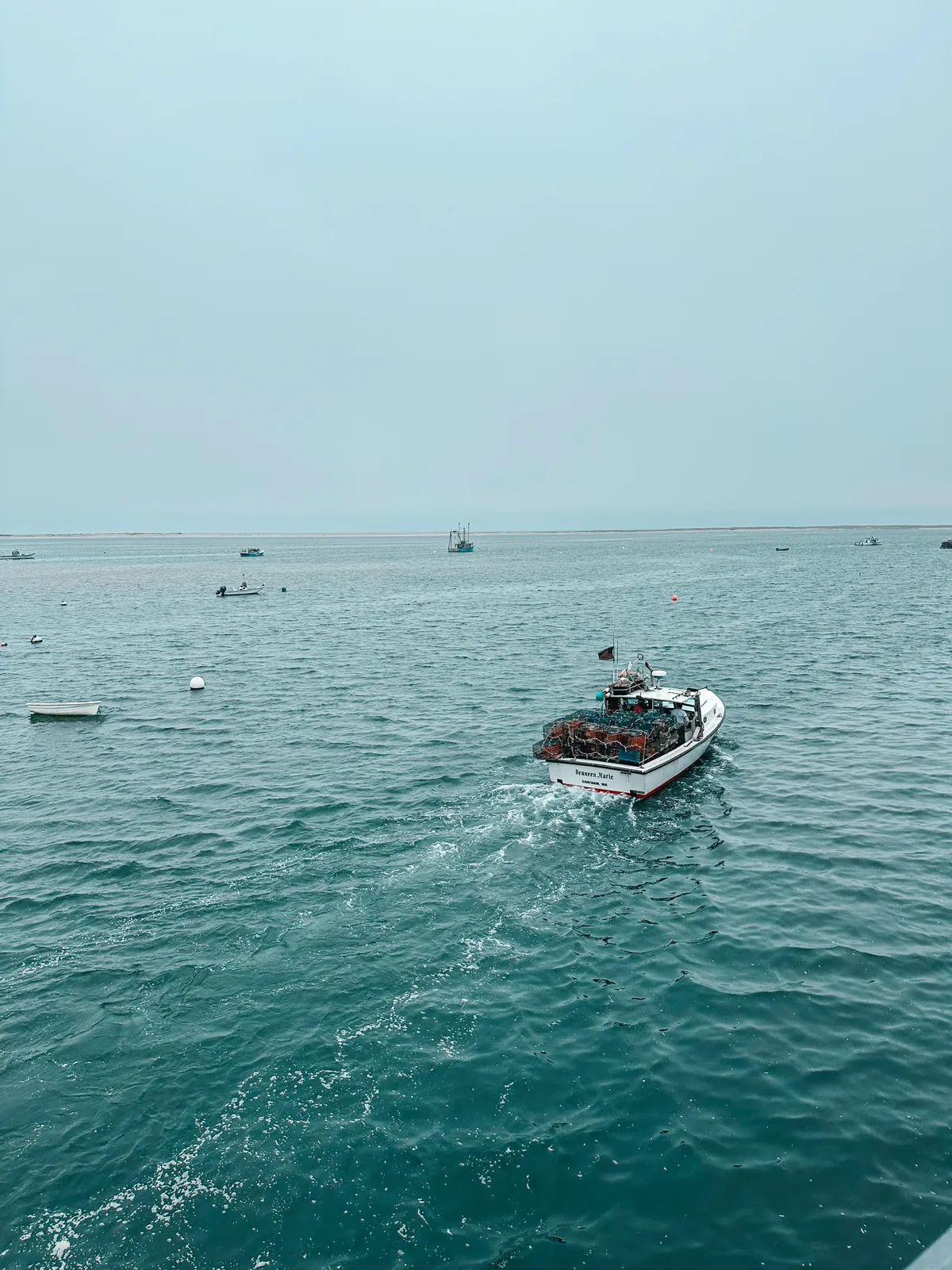 Fishing boats at Chatham Pier Fish Market