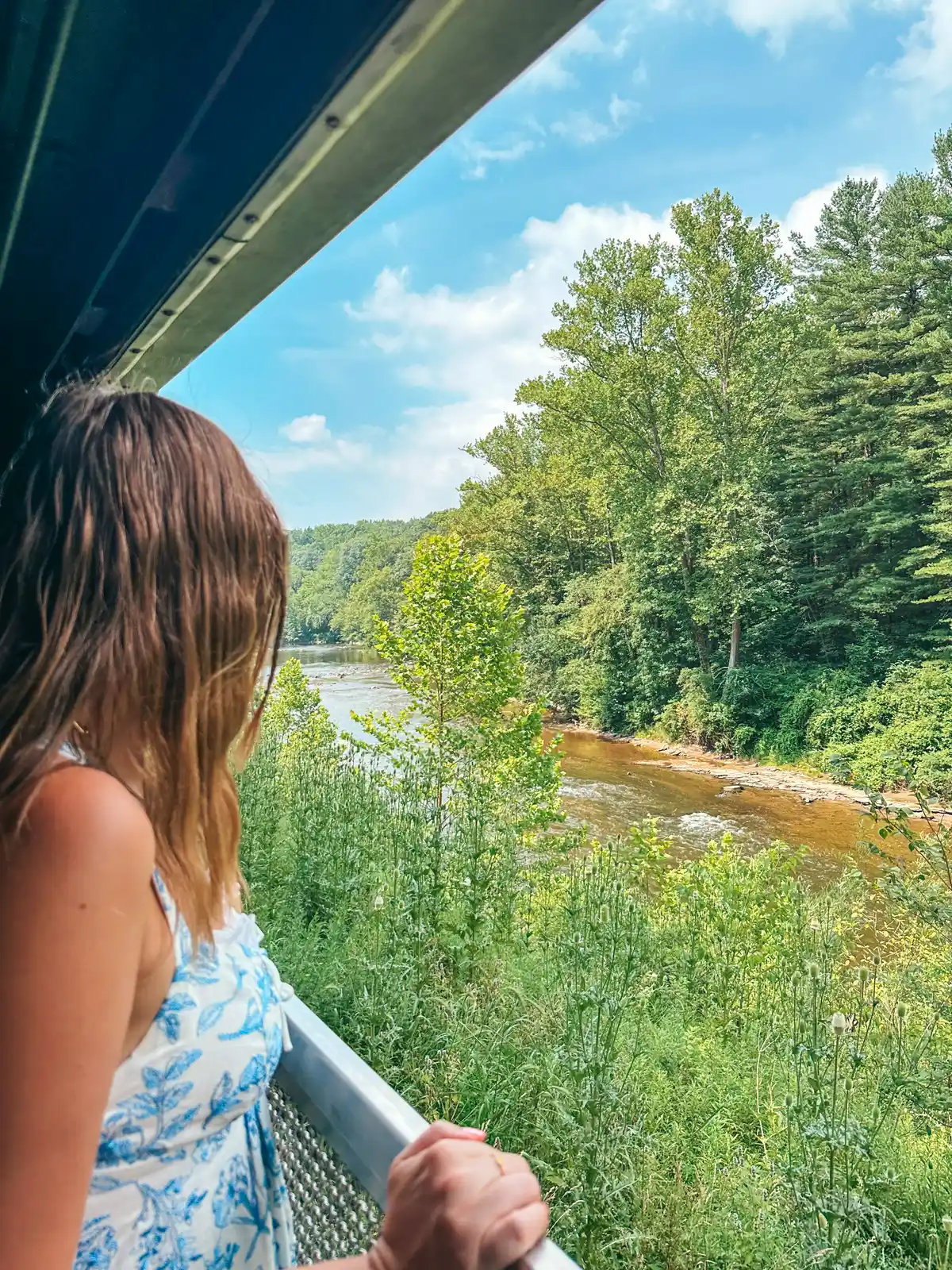 Woman looking out at views from the Cuyahoga Valley Scenic Railroad in Ohio