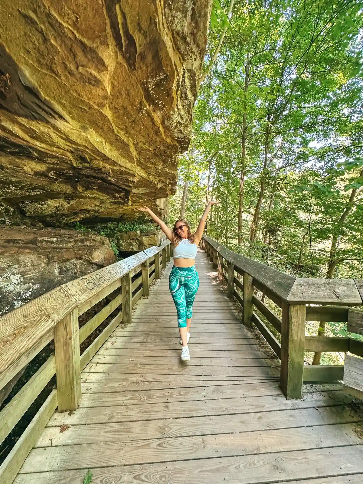 Woman walking on trail to Brandywine Falls in Summit County Ohio