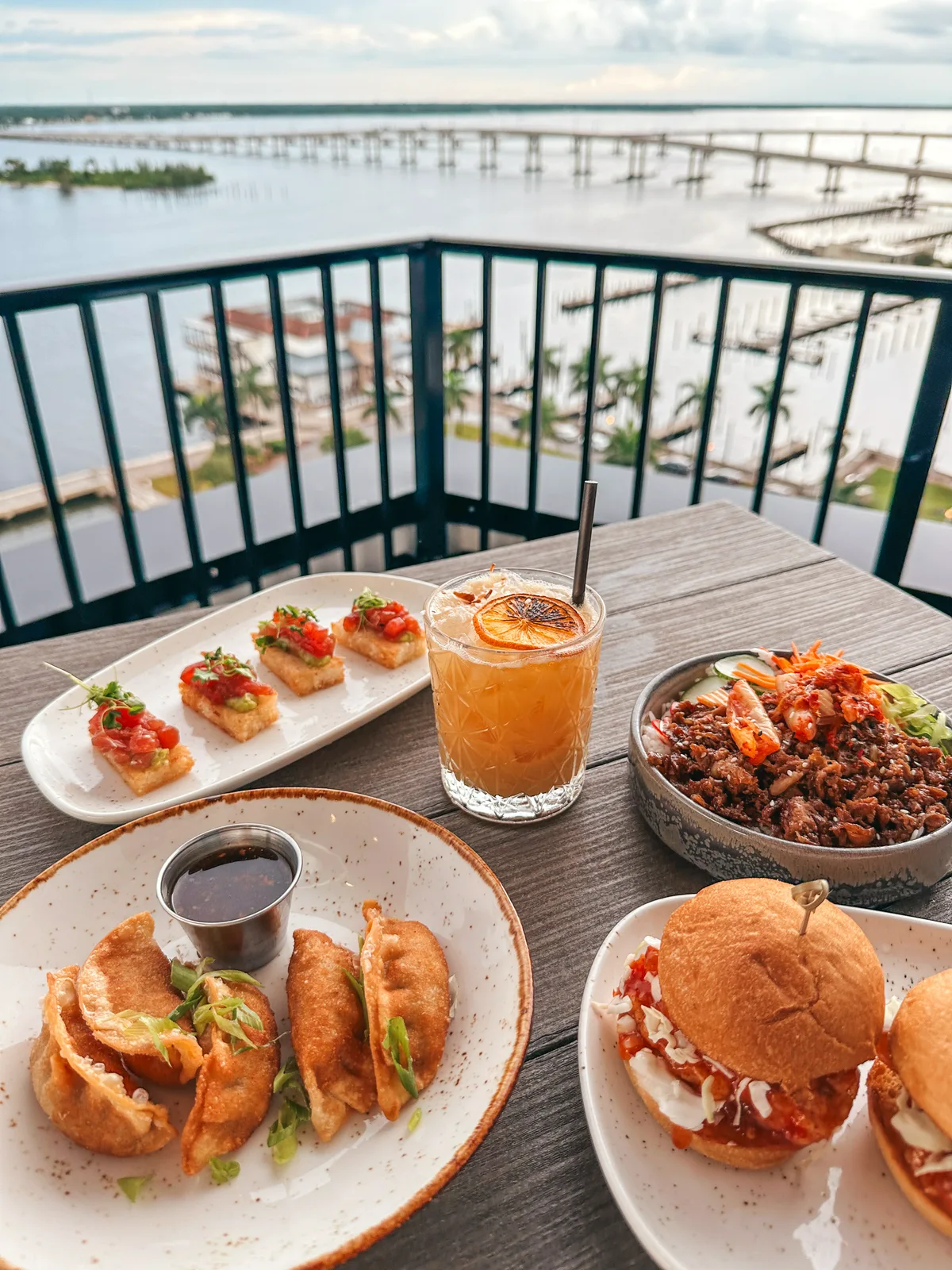Dumplings, sliders, crispy rice, and beef bowl at Beacon Social Drinkery in Fort Myers