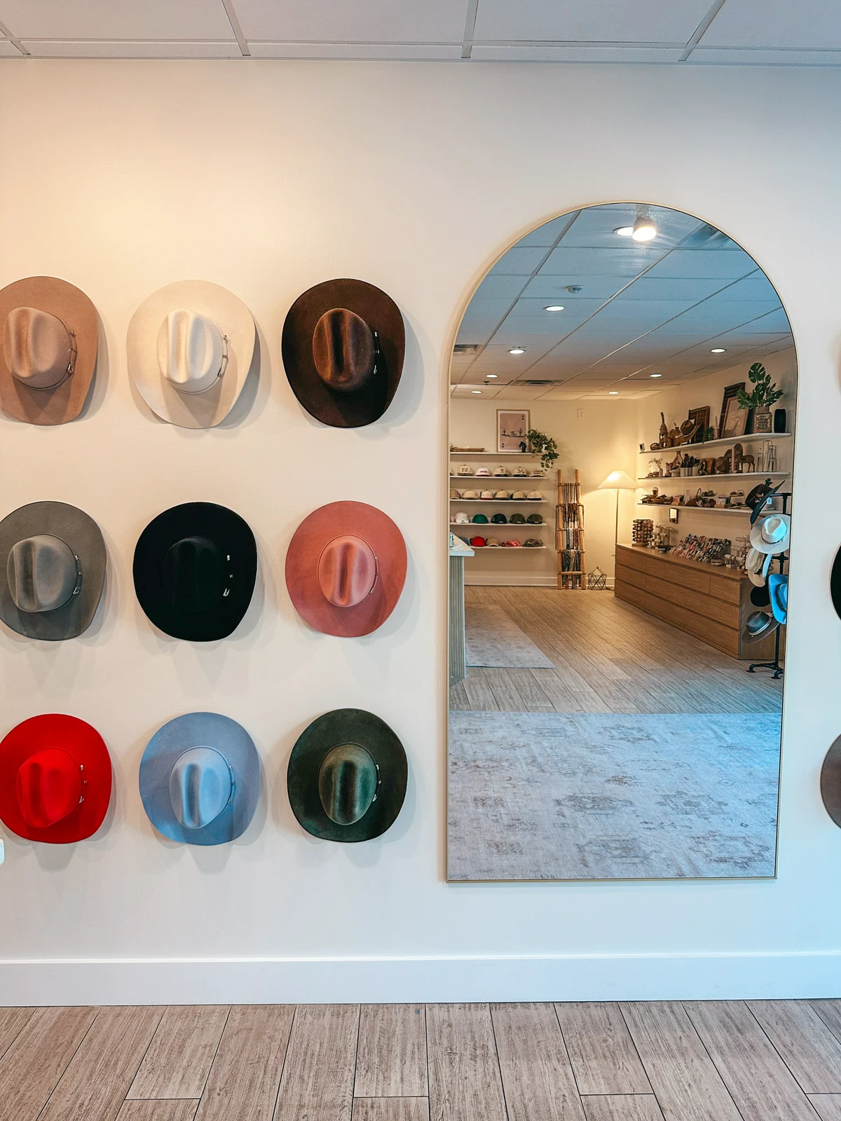 Hat wall at Coastal Cowgirls Collective in Hyde Park Tampa
