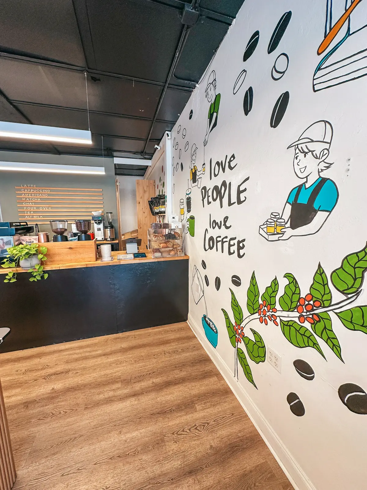 Love people love coffee mural at Good Ground coffee shop in Fort Myers Florida
