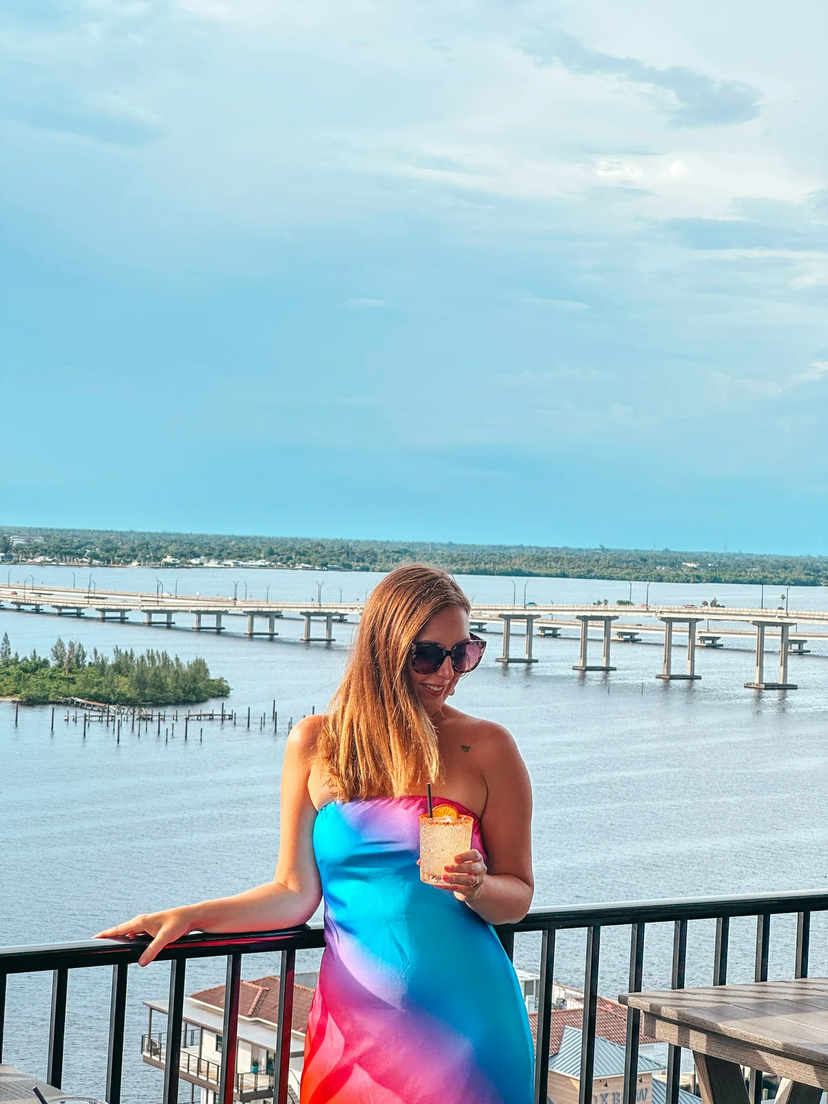Woman enjoying a cocktail at Beacon Social Drinkery in Fort Myers