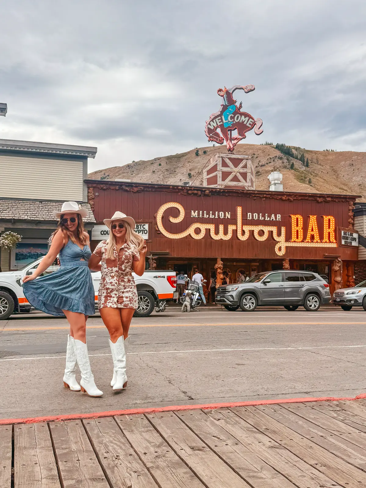 Friends Posing In Front Of Million Dollar Cowboy Bar In Jackson Wyoming