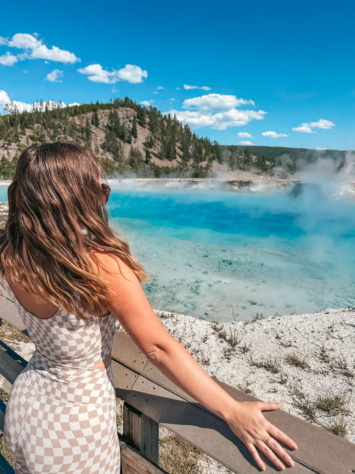 Woman Viewing Excelsior Geysor Crater At Yellowstone Nationai Park