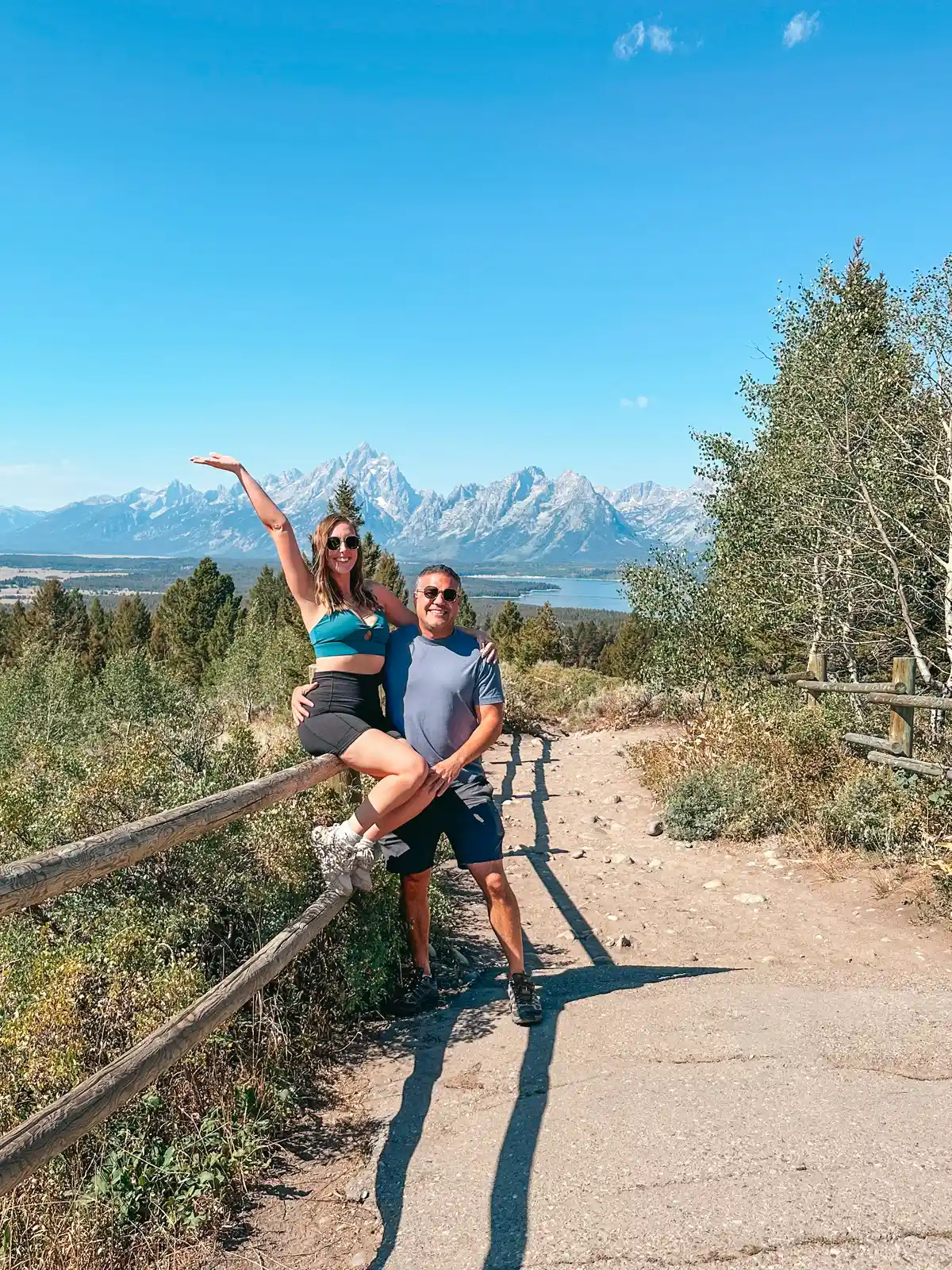 Couple Posing In Front Of Grand Teton Mountain Range View From Signal Mountain In Grand Teton National Park