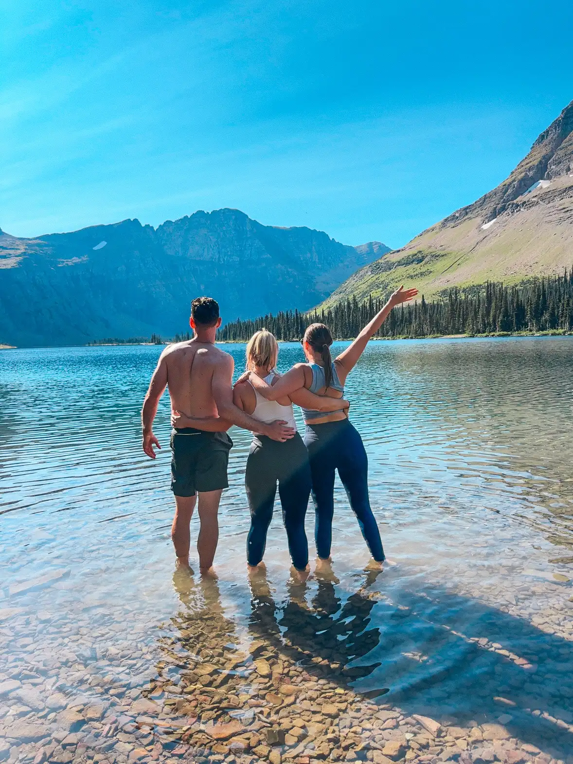 Friends Taking A Dip At Hidden Lake In Glacier National Park
