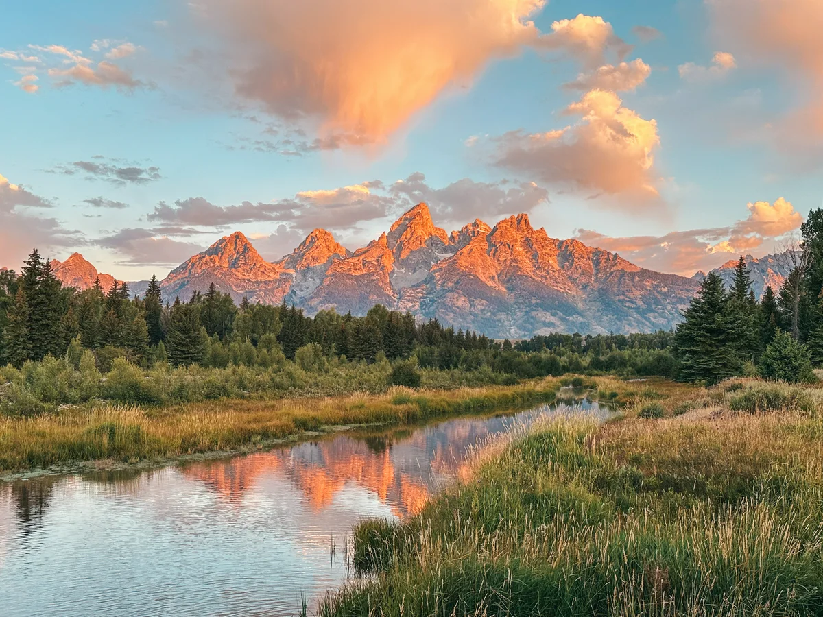 Mountains Glowing Pink For Sunrise At Schwabacher Landing In Grand Teton National Park