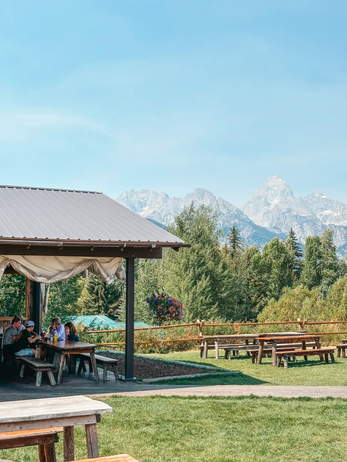 Outdoor Seating With Mountains In The Background At Dornans Chuckwagon In Grand Teton National Park