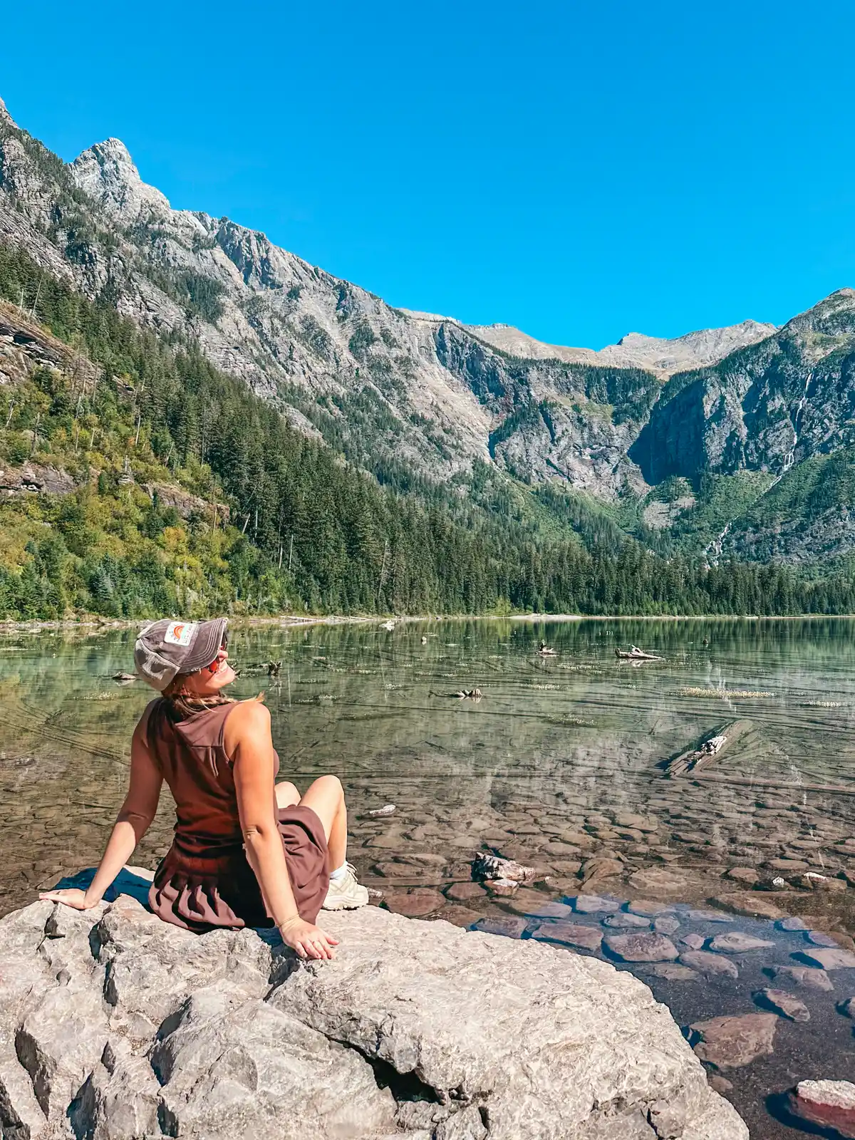 Woman Posing At Avalanche Lake In Glacier National Park