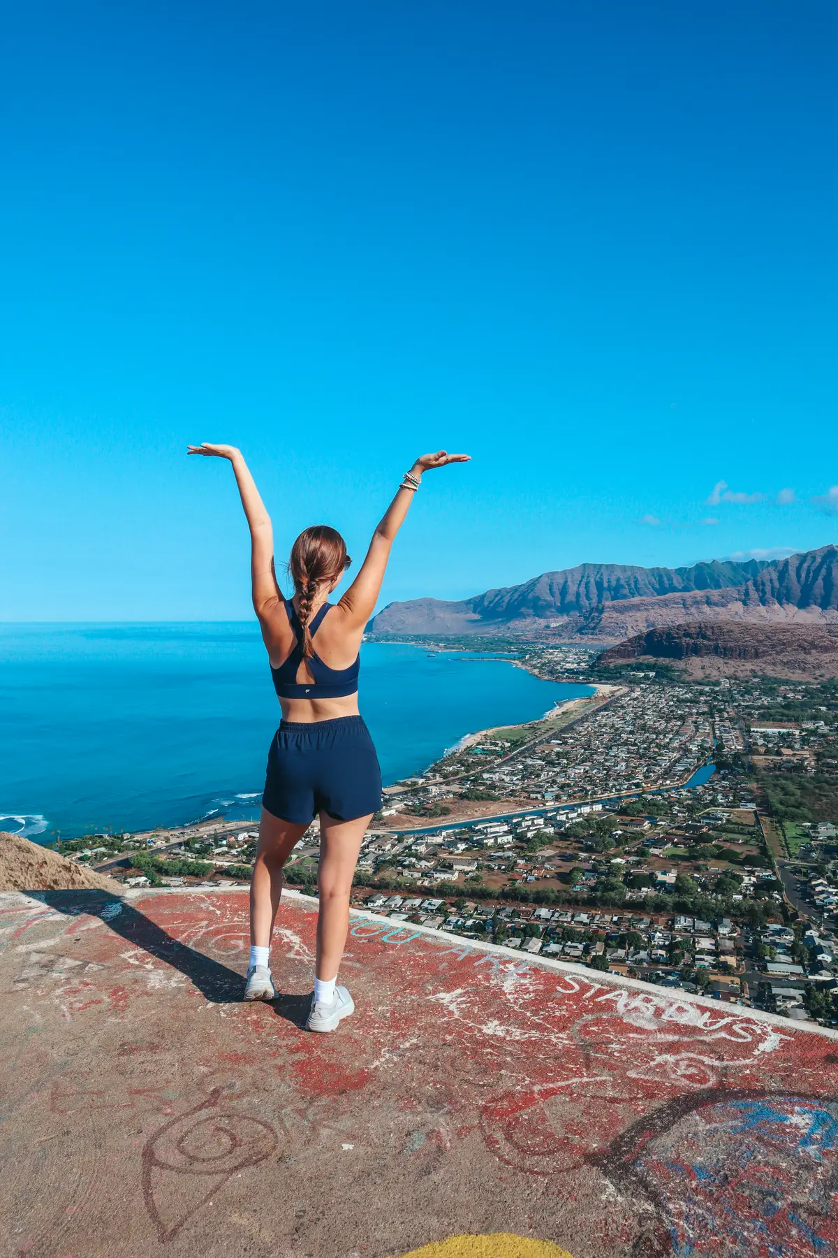 Woman Posing At The Top Of The Pink Pillbox Trail On The West Side Of Oahu