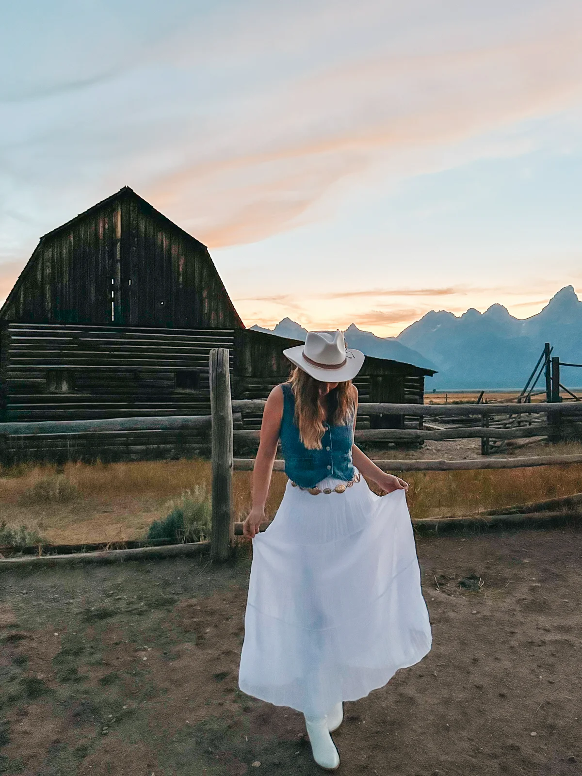 Woman Posing In Front Of Mormon Row At Grand Teton National Park