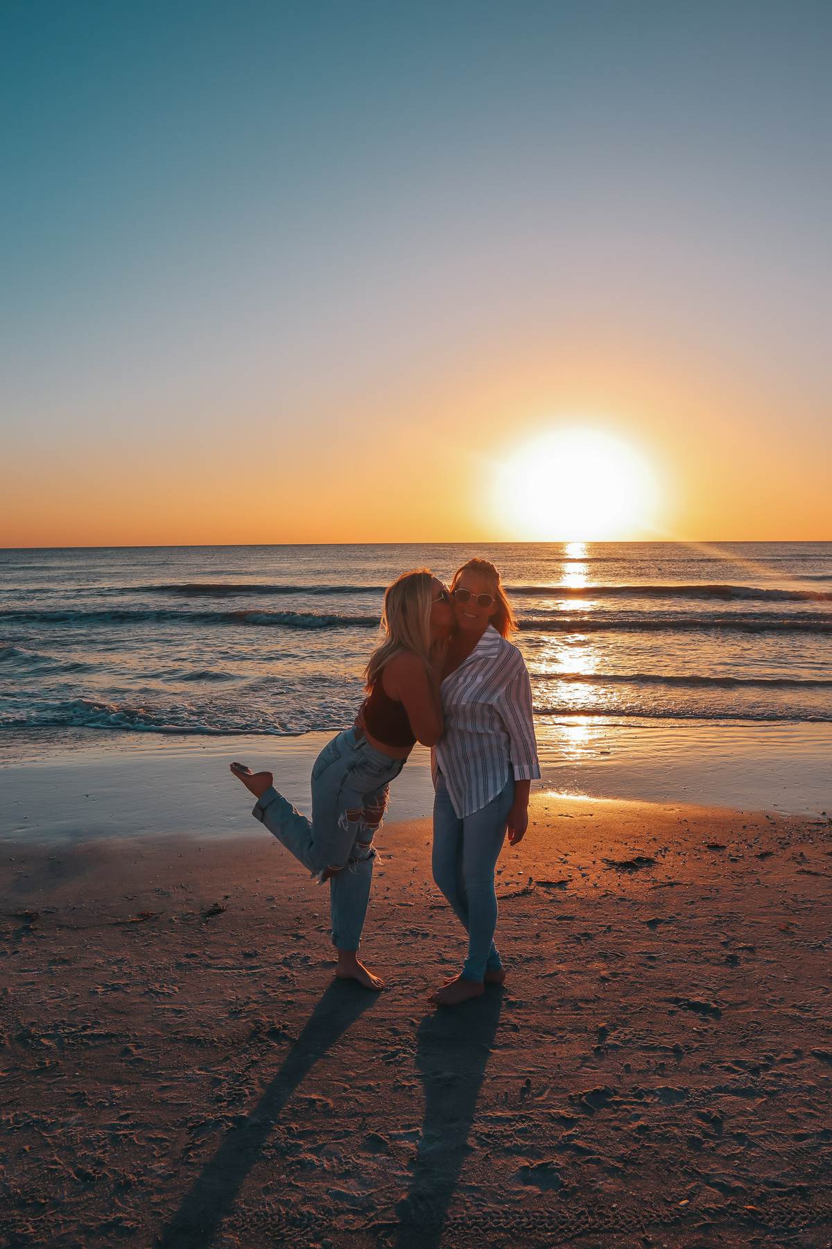 Mother And Daughter On Redington Beach At Sunset